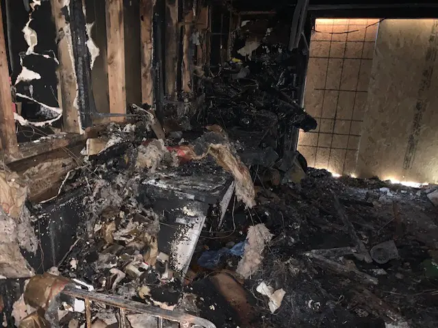 Burned interior with extensive fire damage.