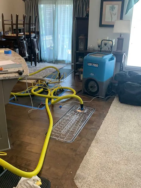 Water damage restoration equipment in a room.