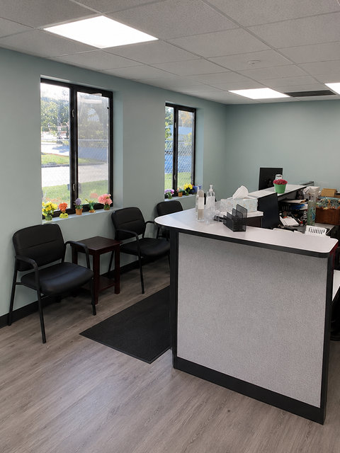 Modern office reception area with seating.