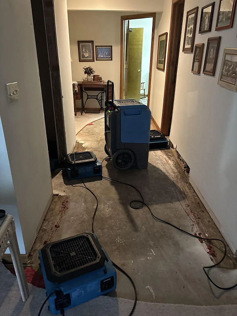 Drying equipment in hallway with removed flooring.