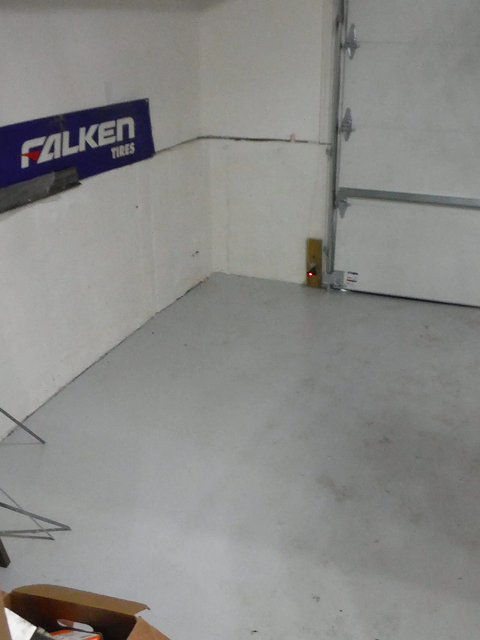 Empty garage with Falken Tires sign.