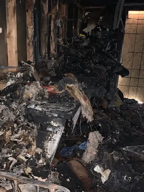 Burnt room with heavy fire damage.