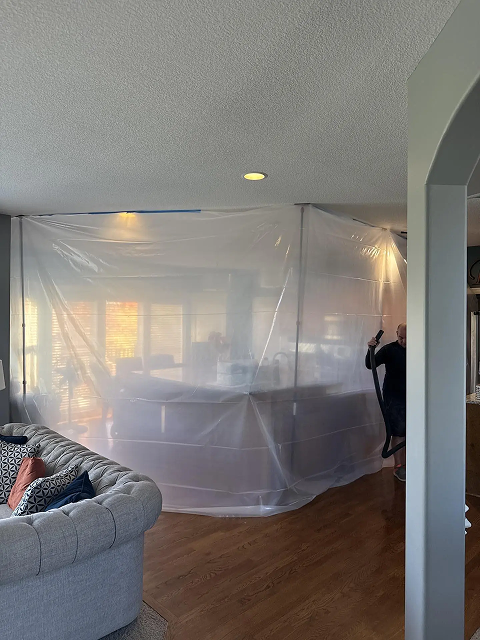 Room sectioned off with plastic sheeting.